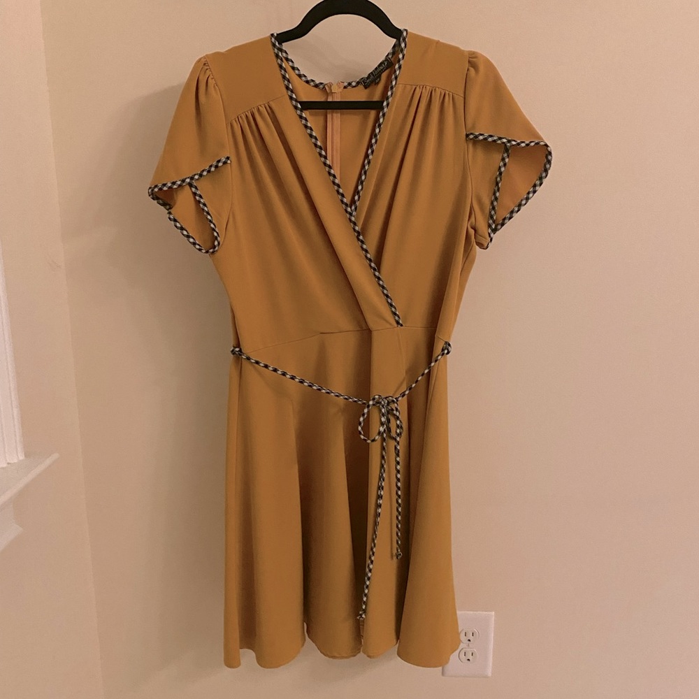 Smak Parlour mustard faux-wrap dress with blue and white trim.
